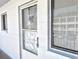 Condo unit entry with a security door and window at 2228 Canal Dr # D26, Bradenton, FL 34207