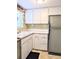 Retro kitchen with light wood cabinets and appliances at 2228 Canal Dr # D26, Bradenton, FL 34207