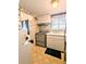 Retro kitchen with light wood cabinets and appliances at 2228 Canal Dr # D26, Bradenton, FL 34207