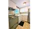 Retro kitchen with light wood cabinets and appliances at 2228 Canal Dr # D26, Bradenton, FL 34207