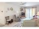 Living room with ample seating, TV, and access to a balcony at 2228 Canal Dr # D26, Bradenton, FL 34207