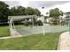 Community shuffleboard courts with covered seating areas at 2228 Canal Dr # D26, Bradenton, FL 34207