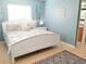 Main bedroom with king-size bed and light blue walls at 3405 Highland W Ave, Bradenton, FL 34205