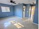 Spacious bedroom with blue walls and tile flooring at 3405 Highland W Ave, Bradenton, FL 34205
