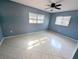 Bedroom with blue walls and tile flooring at 3405 Highland W Ave, Bradenton, FL 34205