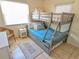 Bedroom with a twin-over-twin bunk bed and coastal decor at 3405 Highland W Ave, Bradenton, FL 34205