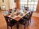 Bright dining room with wood table and six chairs at 3405 Highland W Ave, Bradenton, FL 34205