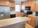 Well-equipped kitchen with wood cabinets and stainless steel appliances at 3405 Highland W Ave, Bradenton, FL 34205