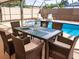 Poolside patio furniture with seating for six at 3405 Highland W Ave, Bradenton, FL 34205