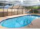 Inviting kidney-shaped pool with a screened enclosure at 3405 Highland W Ave, Bradenton, FL 34205