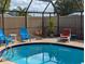 Relaxing screened-in pool area with comfortable seating at 3405 Highland W Ave, Bradenton, FL 34205
