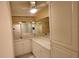 Bathroom with double vanity and a ceiling fan at 3409 Avenida Madera # A, Bradenton, FL 34210