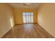 Bedroom with wood-look floors and sliding glass doors at 3409 Avenida Madera # A, Bradenton, FL 34210