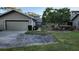 Tan colored house with a two car garage and walkway at 3409 Avenida Madera # A, Bradenton, FL 34210