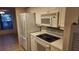 Kitchen boasts a microwave, stove, and refrigerator at 3409 Avenida Madera # A, Bradenton, FL 34210