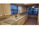 White kitchen with ample counter space and stainless steel appliances at 3409 Avenida Madera # A, Bradenton, FL 34210