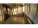 Sunroom with built in shelving and tile floors at 3409 Avenida Madera # A, Bradenton, FL 34210