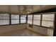 Sunroom with tile floors and multiple windows at 3409 Avenida Madera # A, Bradenton, FL 34210