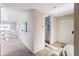 Bright condo entryway with access to the living area and laundry facilities at 350 Golden Gate Pt # 61, Sarasota, FL 34236