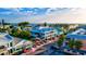 Aerial view of coastal town, showing beach, ocean, and buildings at 3601 E Bay Dr # 203, Holmes Beach, FL 34217
