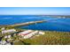 Aerial view of waterfront property with resort-style amenities and stunning water views at 3601 E Bay Dr # 203, Holmes Beach, FL 34217