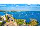 Aerial view of marina with boats and waterfront property at 3601 E Bay Dr # 203, Holmes Beach, FL 34217
