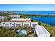 Community view with waterfront access, pool, and lush landscaping at 3601 E Bay Dr # 203, Holmes Beach, FL 34217