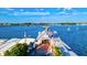 Quaint waterfront town with a pier, restaurant, and boats at 3601 E Bay Dr # 203, Holmes Beach, FL 34217