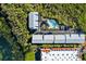 Aerial view of community pool and building at 3601 E Bay Dr # 203, Holmes Beach, FL 34217