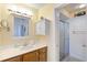 Clean bathroom with a single sink vanity and shower at 3601 E Bay Dr # 203, Holmes Beach, FL 34217