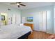 King-size bed and wicker chest in a bright bedroom at 3601 E Bay Dr # 203, Holmes Beach, FL 34217