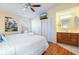 Bright bedroom with a king-size bed and en-suite bathroom at 3601 E Bay Dr # 203, Holmes Beach, FL 34217