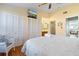King bed, hardwood floors, and coastal decor in this tranquil bedroom at 3601 E Bay Dr # 203, Holmes Beach, FL 34217