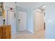 Bright and airy entryway with tile flooring and built-in storage at 3601 E Bay Dr # 203, Holmes Beach, FL 34217