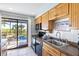 Galley kitchen with stainless steel sink and ocean view at 3601 E Bay Dr # 203, Holmes Beach, FL 34217