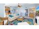 Open living space featuring a comfy sofa and adjacent dining area at 3601 E Bay Dr # 203, Holmes Beach, FL 34217