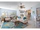 Relaxing living area with wicker armchairs and view of balcony at 3601 E Bay Dr # 203, Holmes Beach, FL 34217