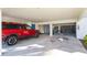 Covered parking area with additional storage at 3601 E Bay Dr # 203, Holmes Beach, FL 34217