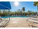 Inviting community pool with lounge chairs and umbrellas at 3601 E Bay Dr # 203, Holmes Beach, FL 34217