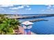 Scenic riverwalk with palm trees and waterfront views at 3601 E Bay Dr # 203, Holmes Beach, FL 34217