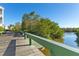 Wooden walkway along the waterfront providing scenic views at 3601 E Bay Dr # 203, Holmes Beach, FL 34217