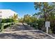 Wooden boardwalk leading to waterfront access with lush greenery at 3601 E Bay Dr # 203, Holmes Beach, FL 34217