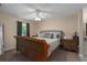 Large main bedroom with a sleigh bed and ceiling fan at 3811 5Th W Ave, Palmetto, FL 34221