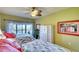 Bright bedroom with two beds and water views at 3920 Mariners Way # 311C, Cortez, FL 34215