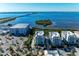 Aerial view of waterfront community, showcasing building and marina views at 396 Aruba Cir # 103, Bradenton, FL 34209