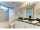 Clean bathroom with a single vanity, tub, and shower at 396 Aruba Cir # 103, Bradenton, FL 34209