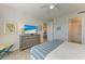 Comfortable bedroom with a king-size bed and dresser, plus views of the ocean at 396 Aruba Cir # 103, Bradenton, FL 34209