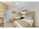 Bright bedroom with twin beds and beach-themed decor at 396 Aruba Cir # 103, Bradenton, FL 34209