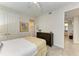 Charming bedroom with twin bed, dresser, and access to bathroom at 396 Aruba Cir # 103, Bradenton, FL 34209