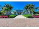 Community clubhouse entrance with brick pavers and landscaping at 396 Aruba Cir # 103, Bradenton, FL 34209